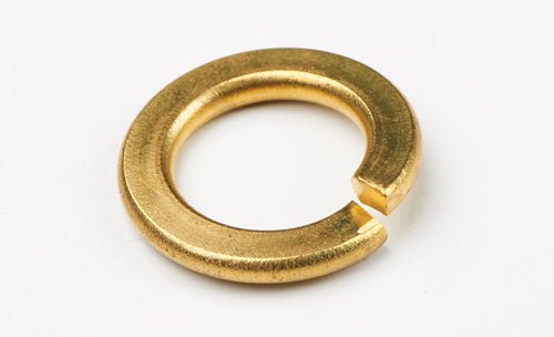 A single brass split lock washer with a helical shape